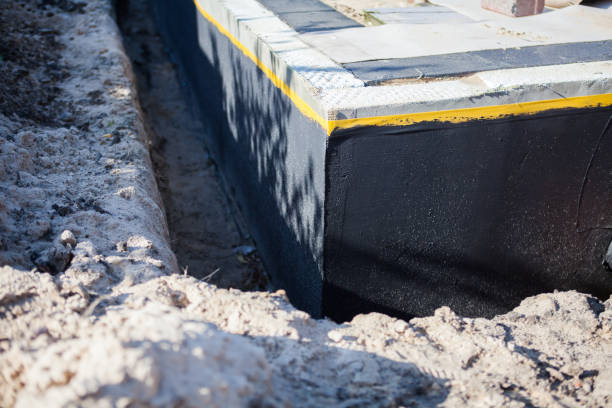 Professional Basement Waterproofing technician working in Farmersville Station, NY